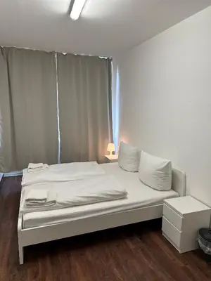 Ein Bett oder Betten in einem Zimmer der Unterkunft Potsdamer Inn