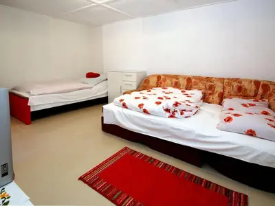 Ein Bett oder Betten in einem Zimmer der Unterkunft Bungalow Gartenidyll, Berlin