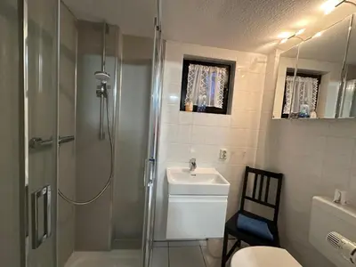 Ein Badezimmer in der Unterkunft Bungalow , Teupitz