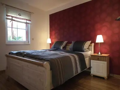 Ein Bett oder Betten in einem Zimmer der Unterkunft Ferienhaus Spreeidyll, Schlepzig