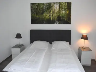 Ein Bett oder Betten in einem Zimmer der Unterkunft Appartements mit Blick auf die Spree in Lübben