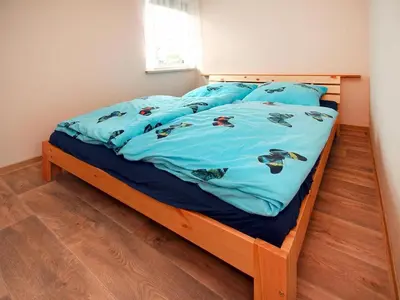 Ein Bett oder Betten in einem Zimmer der Unterkunft Bungalow Am Spreeufer, Lübben