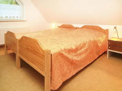 Ein Bett oder Betten in einem Zimmer der Unterkunft Ferienwohnung, Dallgow-Döberitz