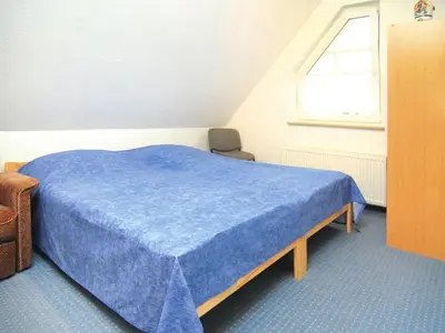 Ein Bett oder Betten in einem Zimmer der Unterkunft Ferienwohnung, Dallgow-Döberitz