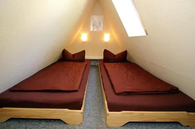 Ein Bett oder Betten in einem Zimmer der Unterkunft Ferienhaus Storchennest 2, Falkensee