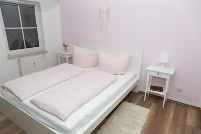 Ein Bett oder Betten in einem Zimmer der Unterkunft Ferienwohnung BadSaarowZentrum