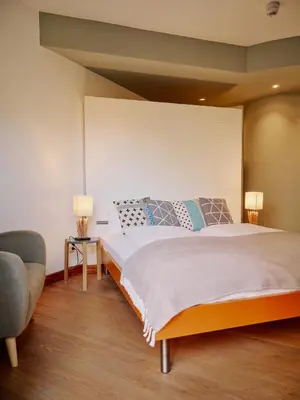 Ein Bett oder Betten in einem Zimmer der Unterkunft Seehotel Villago