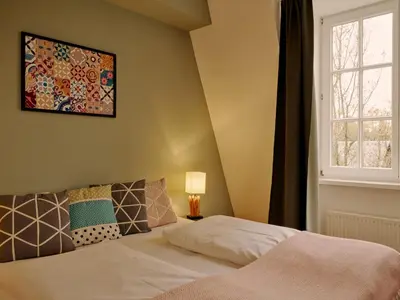 Ein Bett oder Betten in einem Zimmer der Unterkunft Seehotel Villago