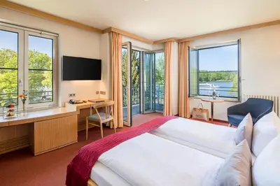 Ein Bett oder Betten in einem Zimmer der Unterkunft Seehotel Rheinsberg