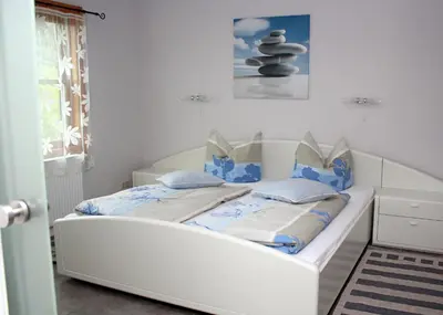 Ein Bett oder Betten in einem Zimmer der Unterkunft Ferienhaus Friedrichswalde