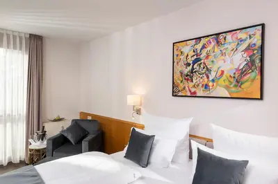 Ein Bett oder Betten in einem Zimmer der Unterkunft Hotel Aquino Berlin
