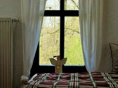 Ein Bett oder Betten in einem Zimmer der Unterkunft Altes Forsthaus Garzau