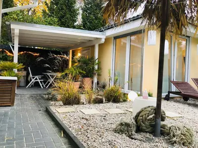 Ein Garten an der Unterkunft Apartment TinyHouse mit Pool, Outdoor Whirlpool und Garten