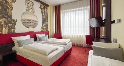 Ein Bett oder Betten in einem Zimmer der Unterkunft PLAZA Premium Berlin Kurfürstendamm