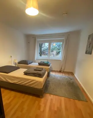 Ein Bett oder Betten in einem Zimmer der Unterkunft Osthafen IV