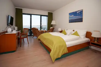 Ein Bett oder Betten in einem Zimmer der Unterkunft Seehotel Berlin-Rangsdorf