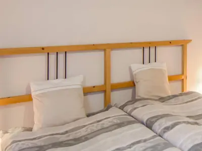 Ein Bett oder Betten in einem Zimmer der Unterkunft Gartenbungalow in Blankenfelde-Mahlow