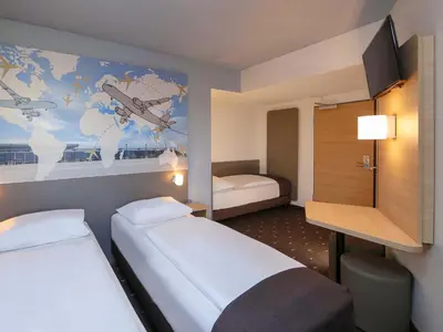 Ein Bett oder Betten in einem Zimmer der Unterkunft B&B Hotel Berlin-Airport