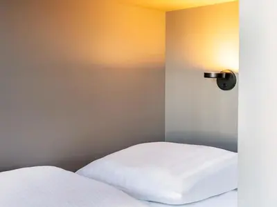 Ein Bett oder Betten in einem Zimmer der Unterkunft B&B Hotel Berlin-Airport