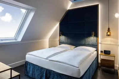 Ein Bett oder Betten in einem Zimmer der Unterkunft Hotel AMO by AMANO Friedrichstraße