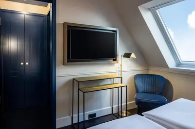 Ein Bett oder Betten in einem Zimmer der Unterkunft Hotel AMO by AMANO Friedrichstraße