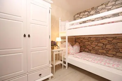 Ein Bett oder Betten in einem Zimmer der Unterkunft Apartmenthaus im holländischen Viertel