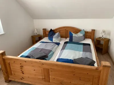 Ein Bett oder Betten in einem Zimmer der Unterkunft Apartment 4 - Gourmetzimmer