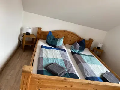 Ein Bett oder Betten in einem Zimmer der Unterkunft Apartment 5 - Gourmetzimmer