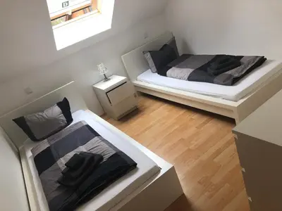 Ein Bett oder Betten in einem Zimmer der Unterkunft Ferienwohnung 2 - Gourmetzimmer