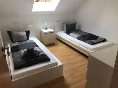 Ein Bett oder Betten in einem Zimmer der Unterkunft Ferienwohnung 1 - Gourmetzimmer