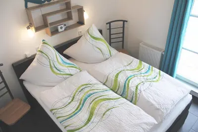 Ein Bett oder Betten in einem Zimmer der Unterkunft 5*Ferienwohnung Seebrise 1