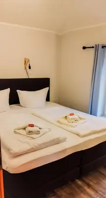 Ein Bett oder Betten in einem Zimmer der Unterkunft Seepavillon Rheinsberg