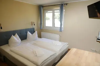 Ein Bett oder Betten in einem Zimmer der Unterkunft Pension Elfmeter