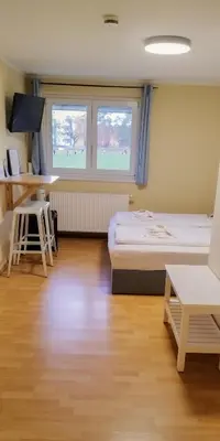 Ein Bett oder Betten in einem Zimmer der Unterkunft Pension Elfmeter