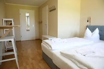Ein Bett oder Betten in einem Zimmer der Unterkunft Pension Elfmeter