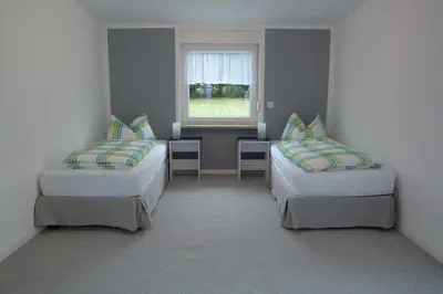 Ein Bett oder Betten in einem Zimmer der Unterkunft Ferienhaus BAUMBLÜTE