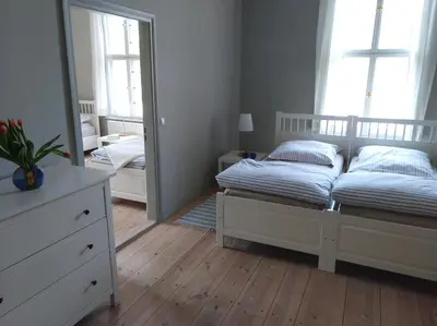 Ein Bett oder Betten in einem Zimmer der Unterkunft Marstall im Schlosspark Rheinsberg