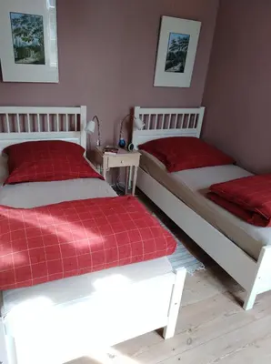 Ein Bett oder Betten in einem Zimmer der Unterkunft Marstall im Schlosspark Rheinsberg