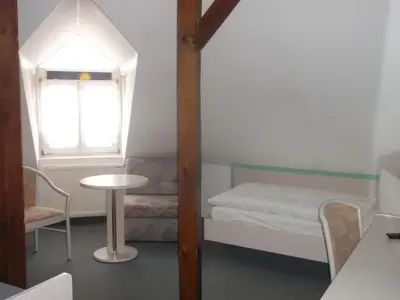 Ein Bett oder Betten in einem Zimmer der Unterkunft Hotel am Seetor