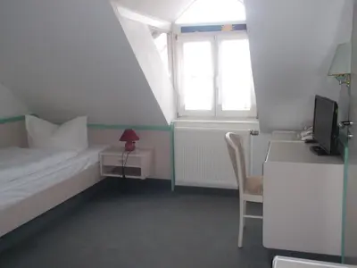 Ein Bett oder Betten in einem Zimmer der Unterkunft Hotel am Seetor