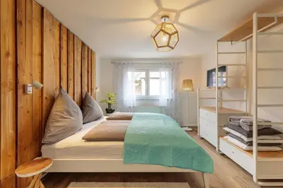 Ein Bett oder Betten in einem Zimmer der Unterkunft Charmantes Haus im Grünen nahe Berlin & Potsdam