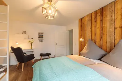 Ein Bett oder Betten in einem Zimmer der Unterkunft Charmantes Haus im Grünen nahe Berlin & Potsdam