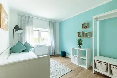Ein Bett oder Betten in einem Zimmer der Unterkunft Charmantes Haus im Grünen nahe Berlin & Potsdam