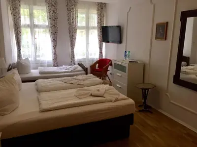 Ein Bett oder Betten in einem Zimmer der Unterkunft Pension Tempelhof