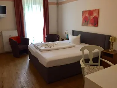 Ein Bett oder Betten in einem Zimmer der Unterkunft Pension Tempelhof