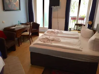 Ein Bett oder Betten in einem Zimmer der Unterkunft Pension Tempelhof