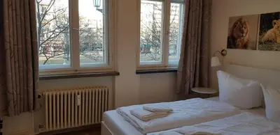 Ein Bett oder Betten in einem Zimmer der Unterkunft Frankfurter Tor