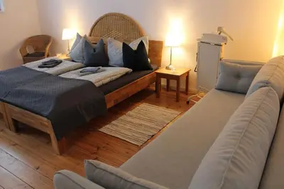 Ein Bett oder Betten in einem Zimmer der Unterkunft OG Die alte Stadtmühle direkt an der Flämingskate