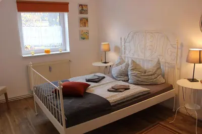 Ein Bett oder Betten in einem Zimmer der Unterkunft OG Die alte Stadtmühle direkt an der Flämingskate