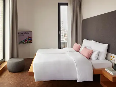 Ein Bett oder Betten in einem Zimmer der Unterkunft Numa Berlin Drift